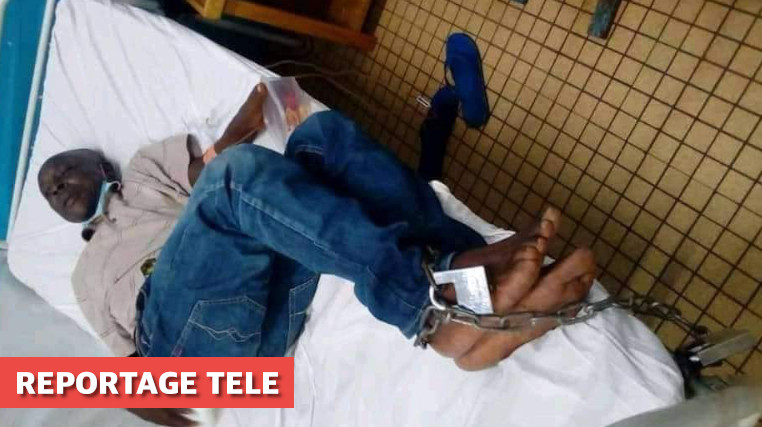 UN DÉTENU ENCHAINÉ SUR UN LIT D’HOPITAL